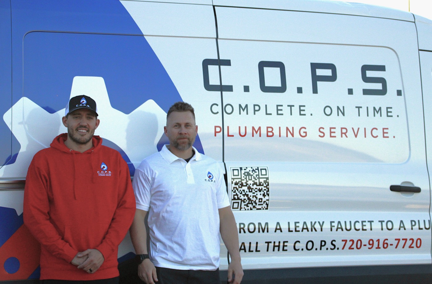 Thomas and Matt, founders of C.O.P.S. Plumbing, standing by their service van