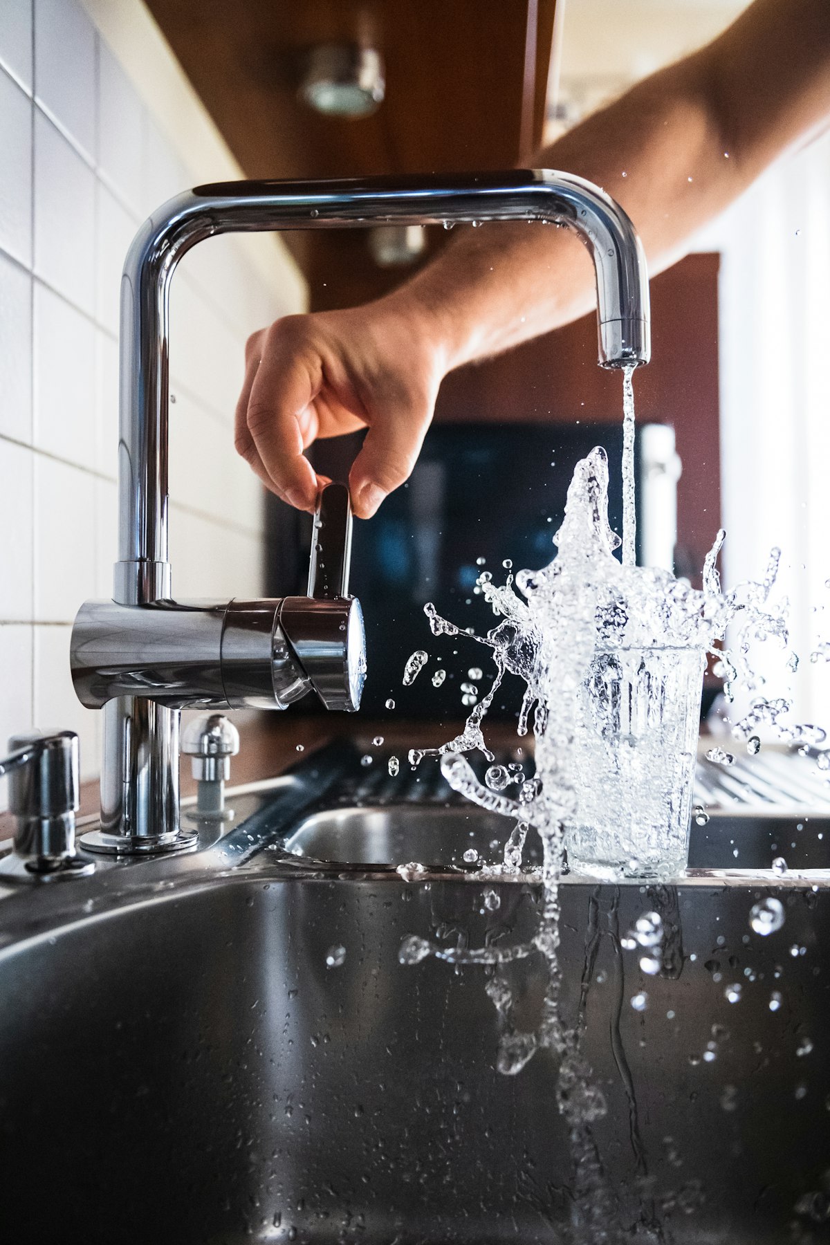 New kitchen faucet installed by a plumber