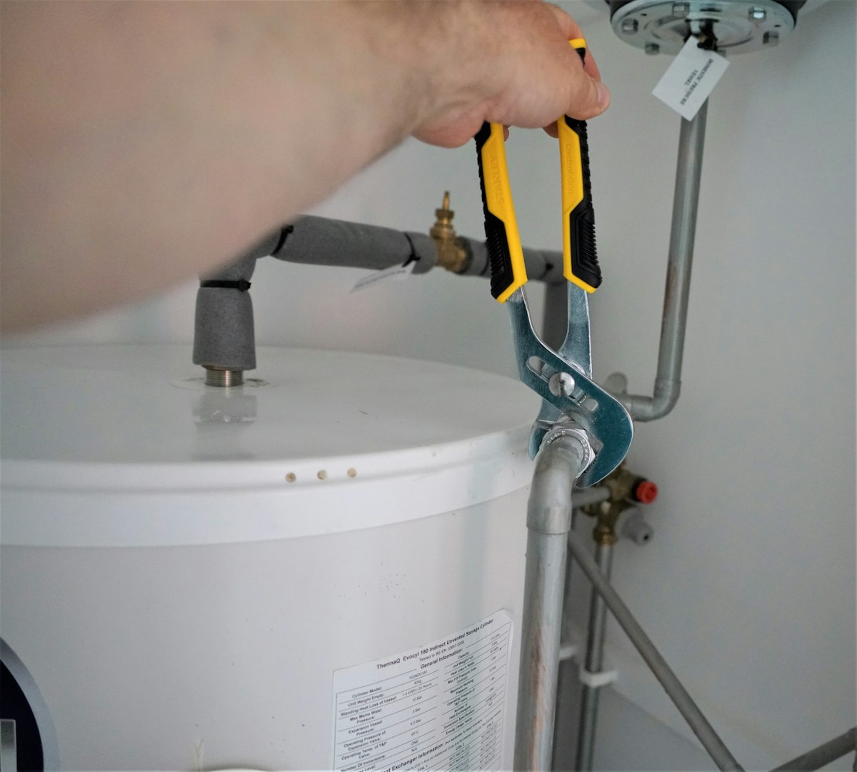 Technician servicing a residential water heater